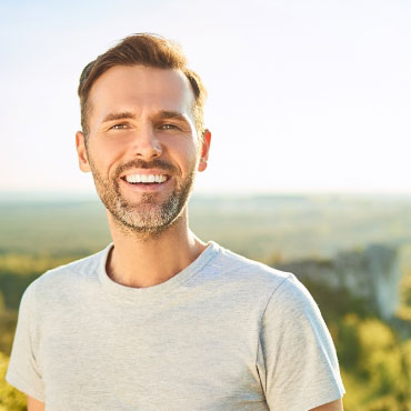 Smiling Man on top of an overlook